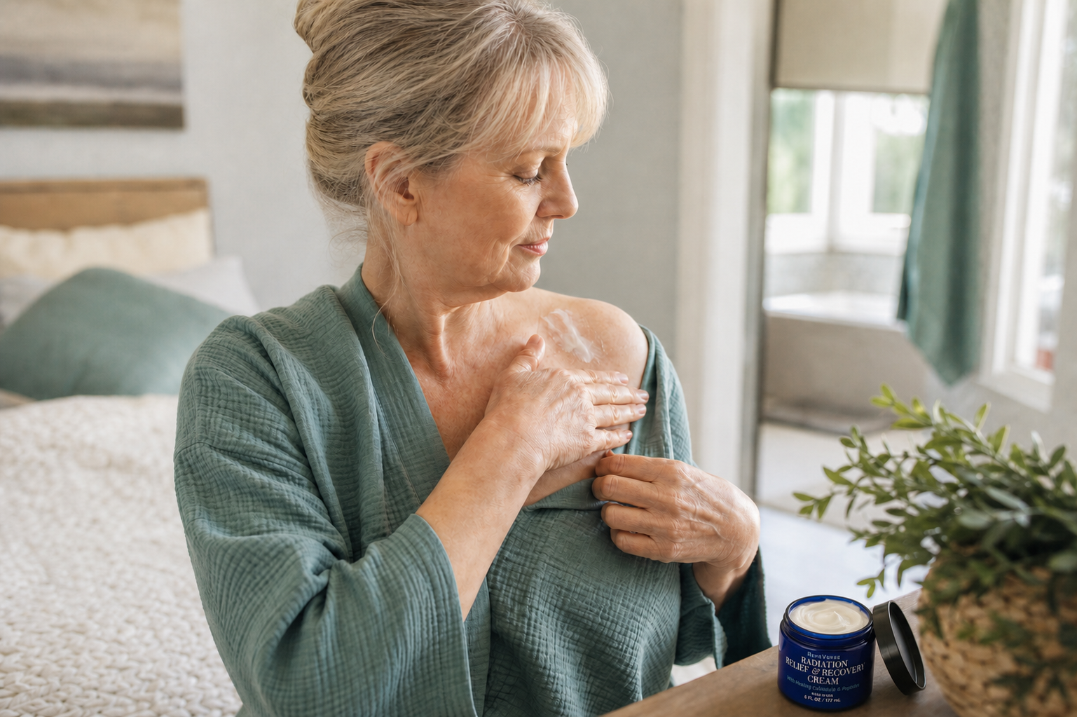 Woman gently applying Radiation Relief Recovery Cream to her upper chest and shoulder